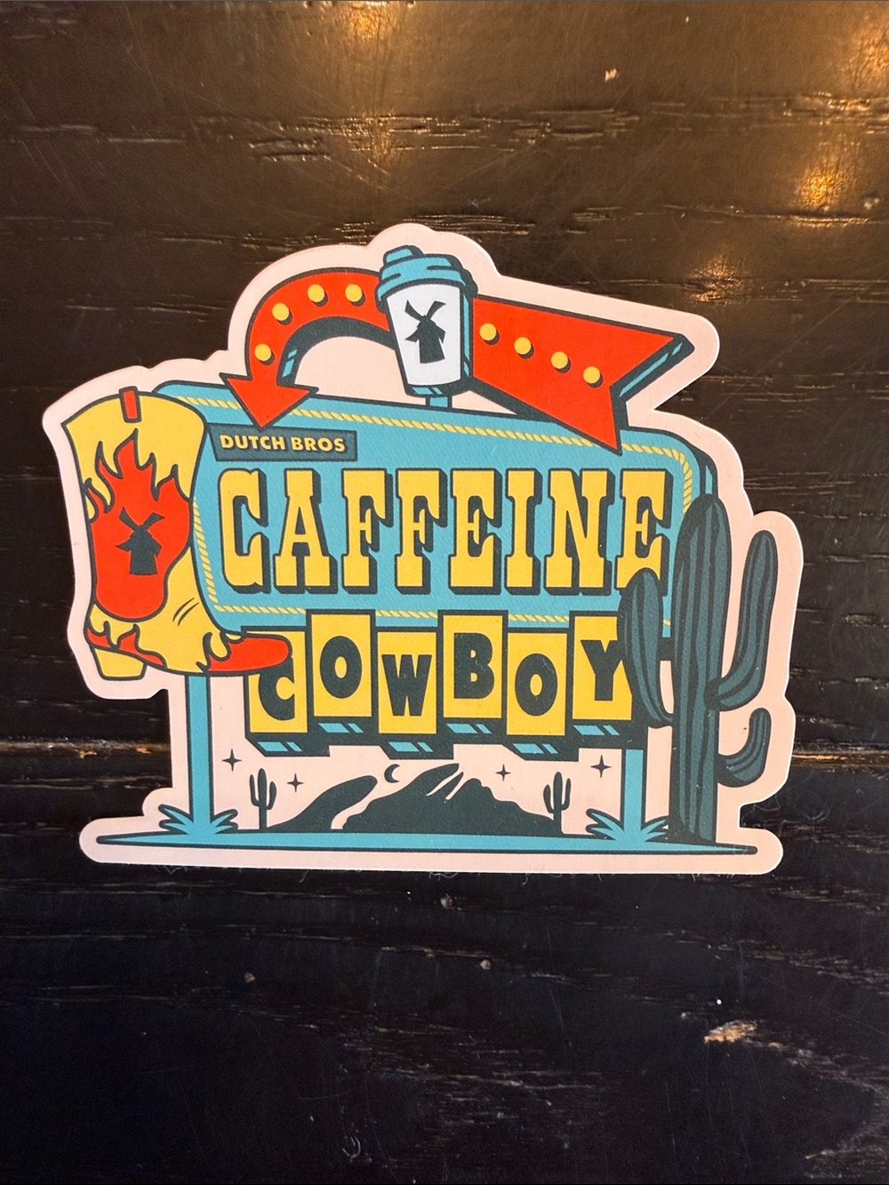 Dutch Bros Caffeine Cowboy Sticker - Yellow, Teal, Red, Black